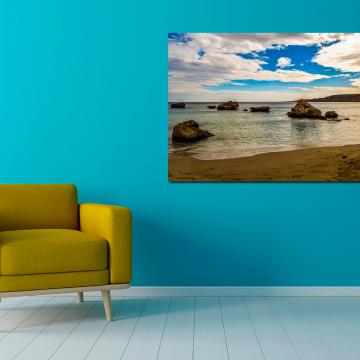 Pintura de praia de areia e pedras