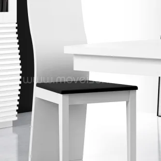Cadeira Ellipse branca com assento preto junto a mesa de jantar branca