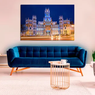 Quadro Palácio das Comunicações iluminado ao anoitecer sobre sofá azul