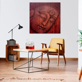 Quadro vermelho com rosto sereno de Buda pendurado numa sala moderna