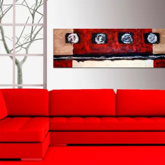 Quadro Jeno abstrato vermelho e bege com faixas e círculos negros, acima de sofá vermelho