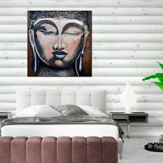 Quadro com rosto de Buda pendurado acima da cama num quarto moderno