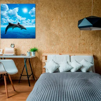 Quadro Golfinhos a par na parede de um quarto com dois golfinhos sobre o mar