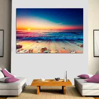 Quadro atardecer com pôr do sol sobre o mar e rochas