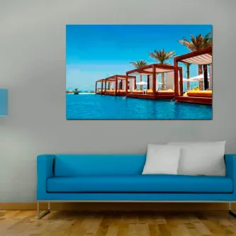 Quadro Merecido Descanso com cabanas e espreguiçadeiras junto à piscina e mar