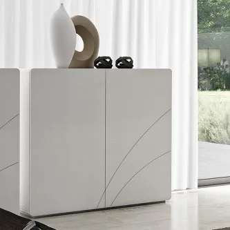 Movel bar Curve branco mate com frentes curvadas e vasos decorativos no topo