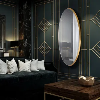 Espelho Aries New redondo com moldura dourada e parede geométrica escura