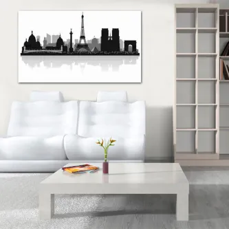 Gráfico preto de silhuetas de cidades sobre parede branca