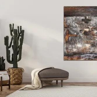 Pintura abstrata em marrom na parede sobre banco, ao lado de cacto