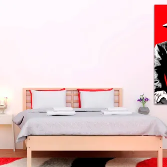 Quarto com cama de casal e quadro pop art 'caixa vermelha do bogart' na parede direita