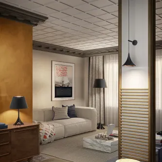 Candeeiro de pé Picollo preto junto a sofá numa sala moderna e acolhedora