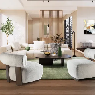 Cadeirão Naomi branco bouclé curvo numa sala moderna com mesa de centro