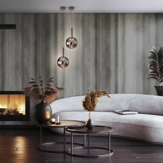 Candeeiro de teto Sapore com dois pendentes esféricos em vidro refletor sobre sofá.