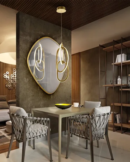 Candeeiro suspenso Nexo dourado com anéis iluminados sobre mesa de jantar moderna