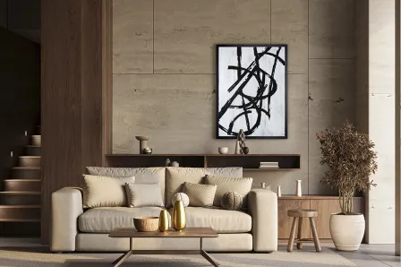 Quadro Graphos Blanco com traços abstratos negros sobre fundo branco, pendurado acima de sofá