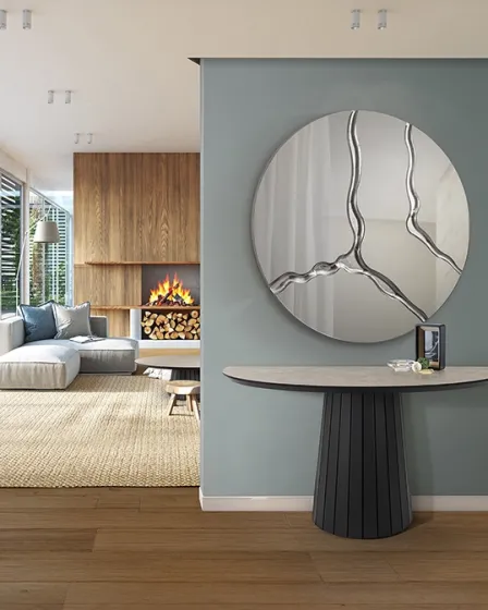 Consola Koria com tampo cinzento e espelho redondo decorativo numa sala moderna