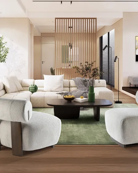 Cadeirão Naomi branco bouclé curvo numa sala moderna com mesa de centro