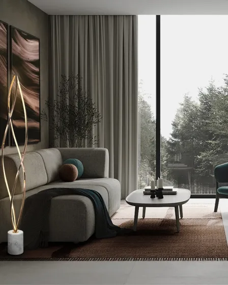 Candeeiro de pé Adele dourado com base em mármore junto a sofá moderno