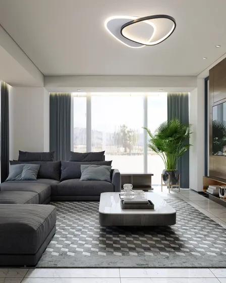 Plafon romo redondo iluminado numa sala de estar moderna com sofá cinzento