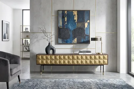 Móvel TV Luxar dourado com frente geométrica 3D e pés metálicos