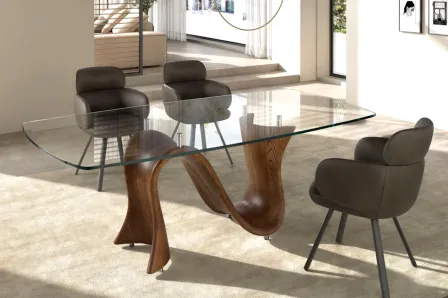 Mesa jantar oval Tauro com tampo de vidro e base escultórica em madeira