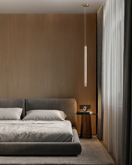 Candeeiro suspenso Muse pendente junto a cama num quarto minimalista